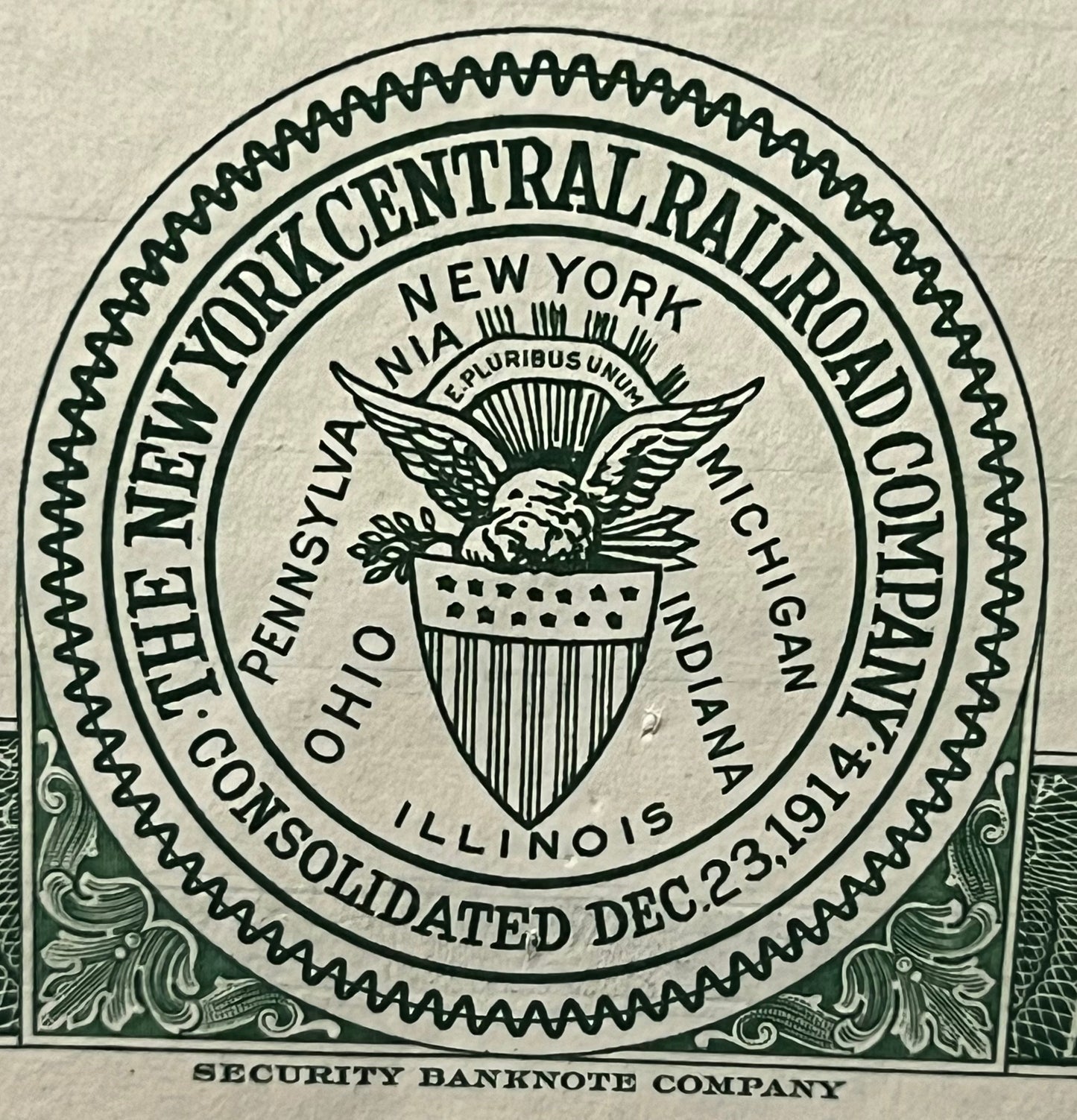 Ornate circular seal of New York Central Railroad Company printed in black on cream paper, showing eagle emblem and text read
