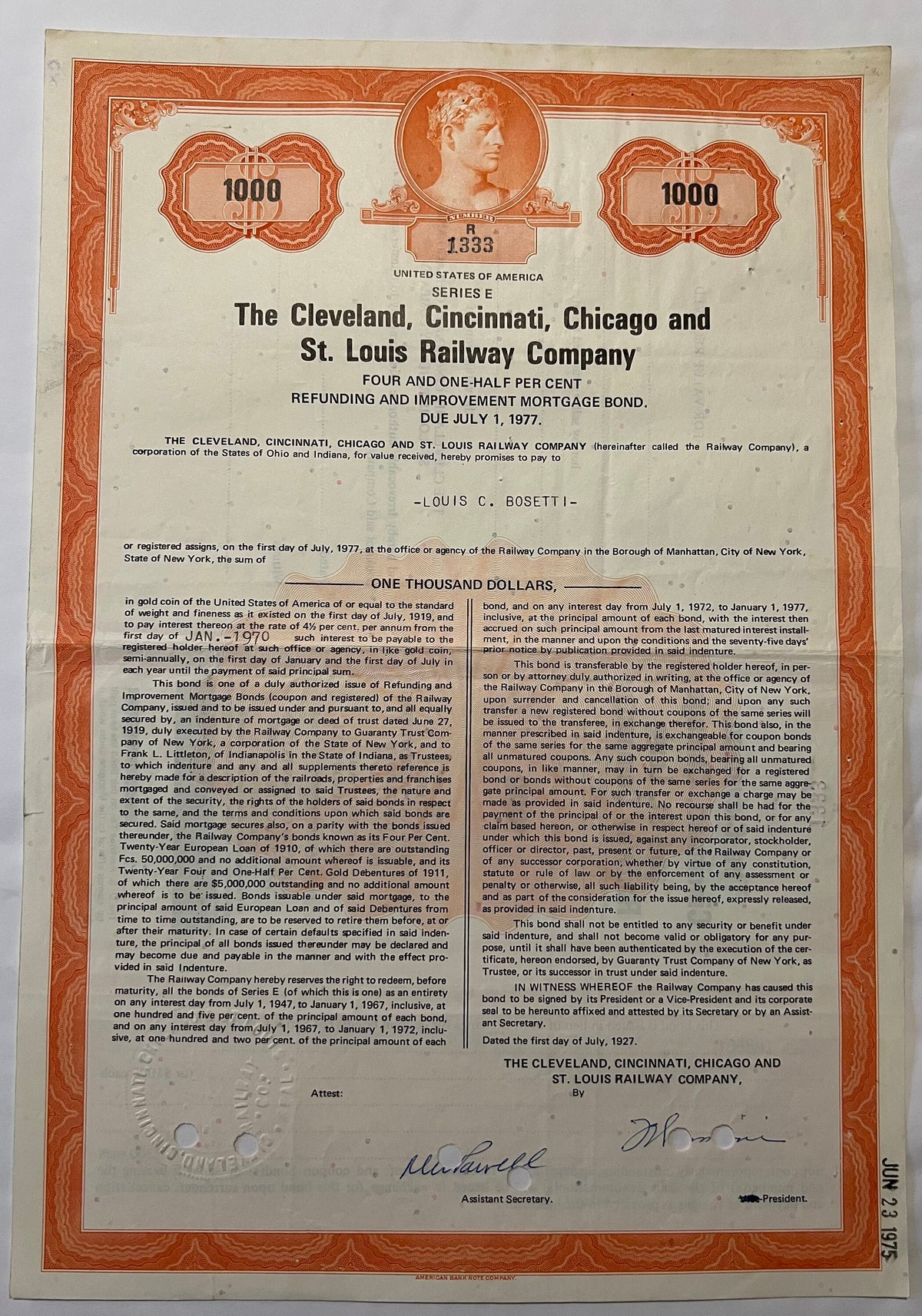 Full page of 1927 railroad bond certificate with orange decorative border, portrait medallion, and black text on cream paper,