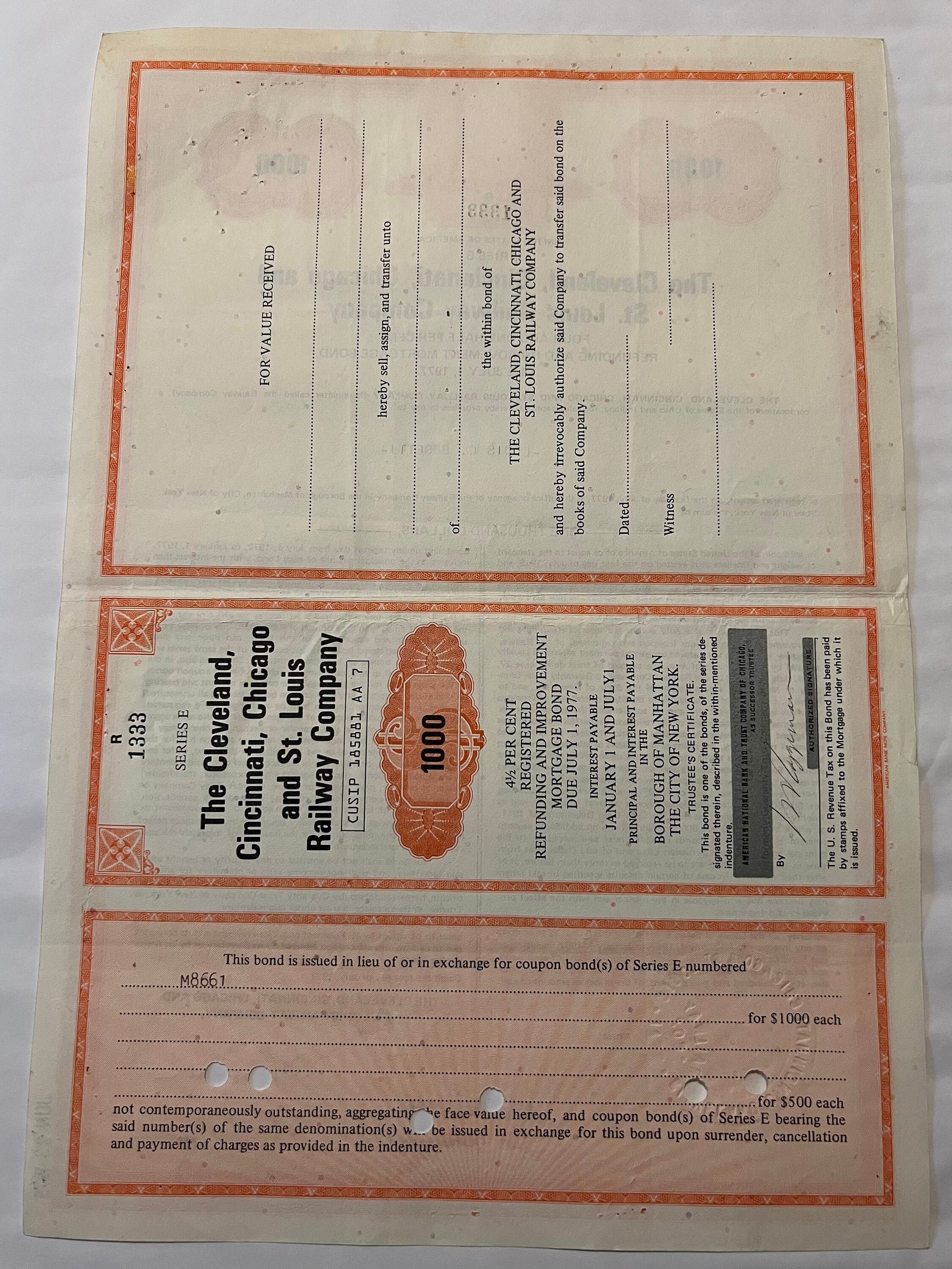 Vintage 1927 railroad bond certificate with orange border and decorative head design, numbered 100, for Cleveland Cincinnati 