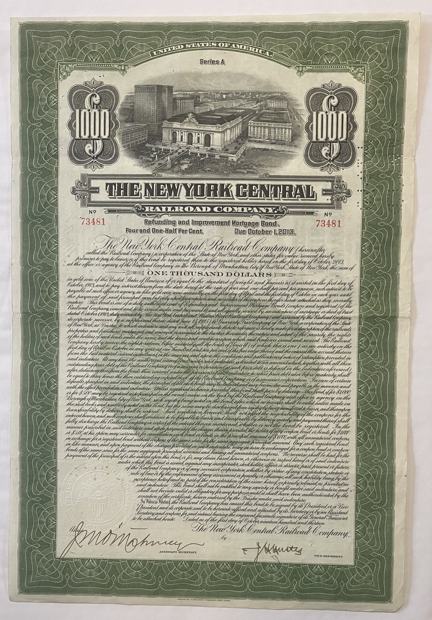 Green and cream 1913 New York Central Railroad $1,000 bond certificate with Grand Central Terminal vignette and ornamental bo