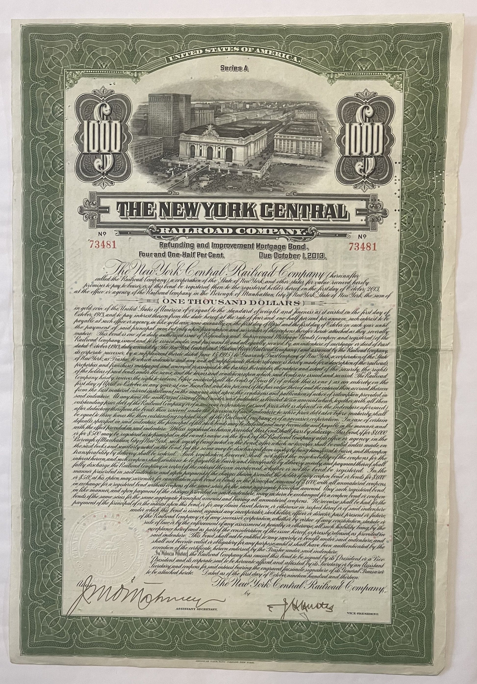 Green and cream 1913 New York Central Railroad $1,000 bond certificate with Grand Central Terminal vignette and ornamental bo
