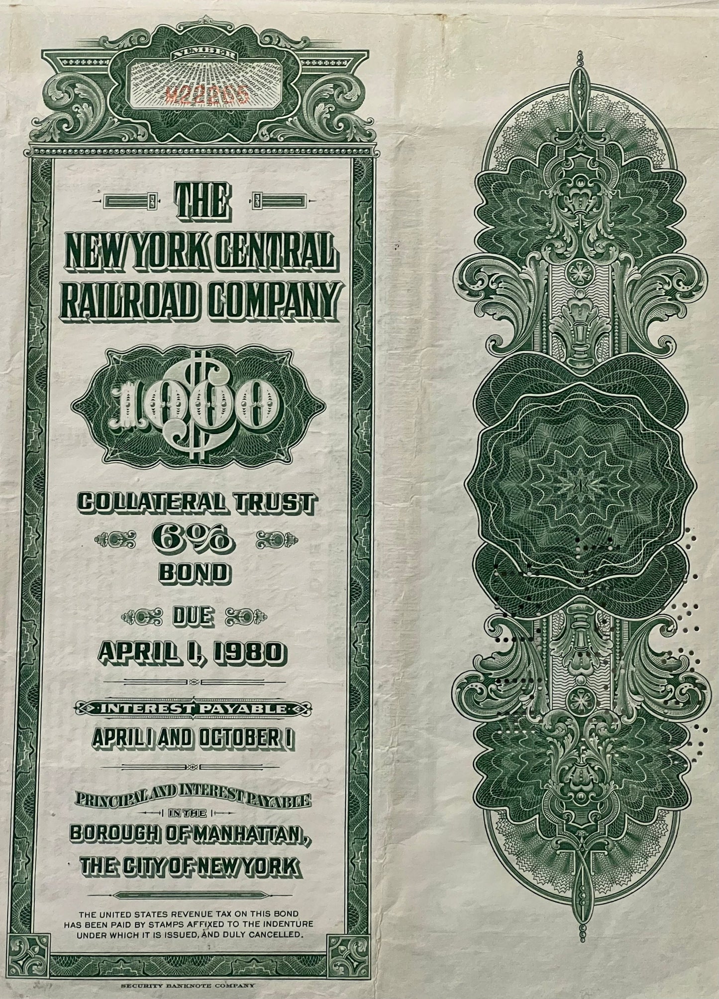 Front and back of green and cream vintage New York Central Railroad $1,000 bond certificate with ornate decorative borders an