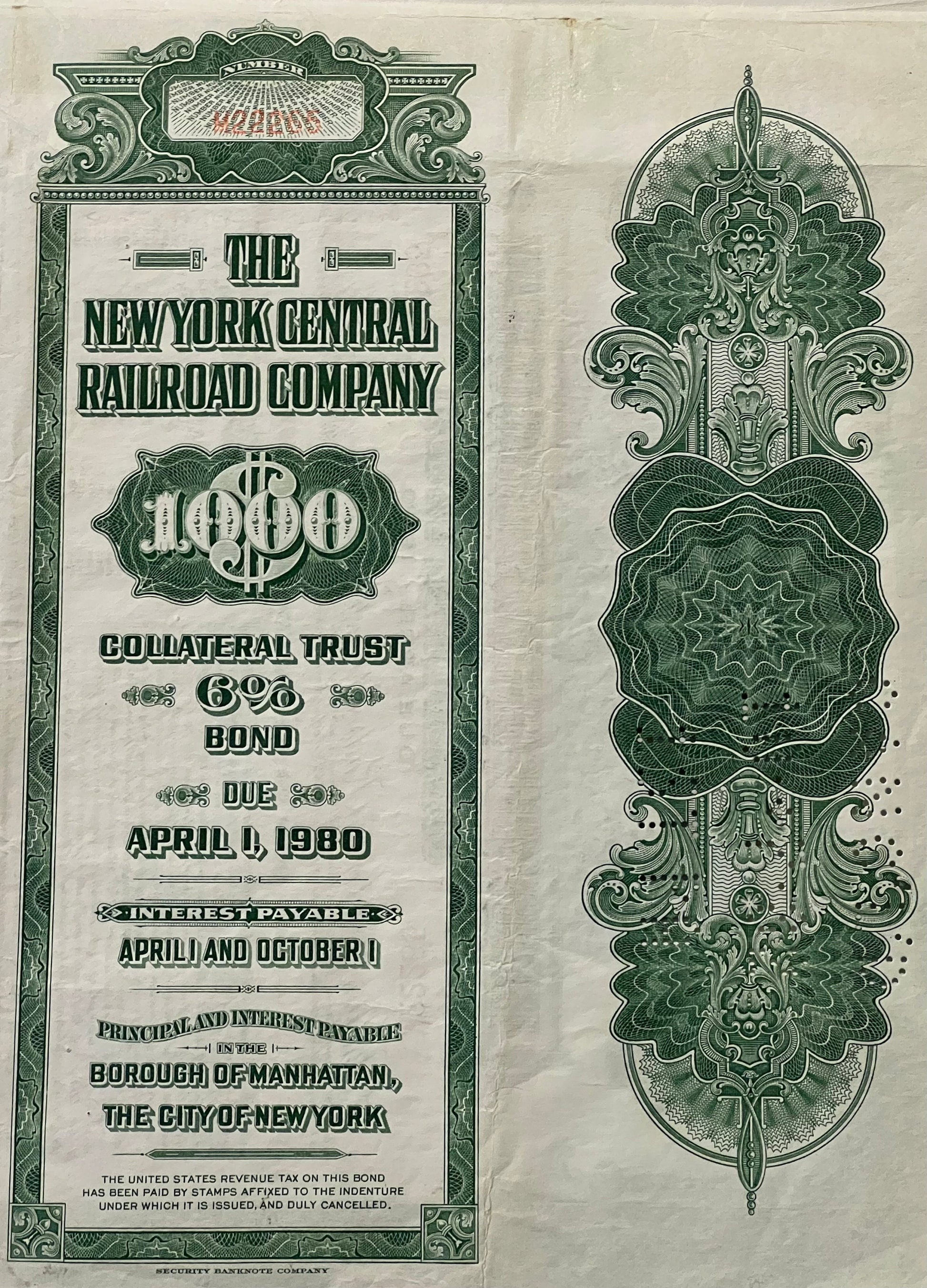 Front and back of green and cream vintage New York Central Railroad $1,000 bond certificate with ornate decorative borders an
