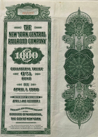 Front and back of green and cream vintage New York Central Railroad $1,000 bond certificate with ornate decorative borders an