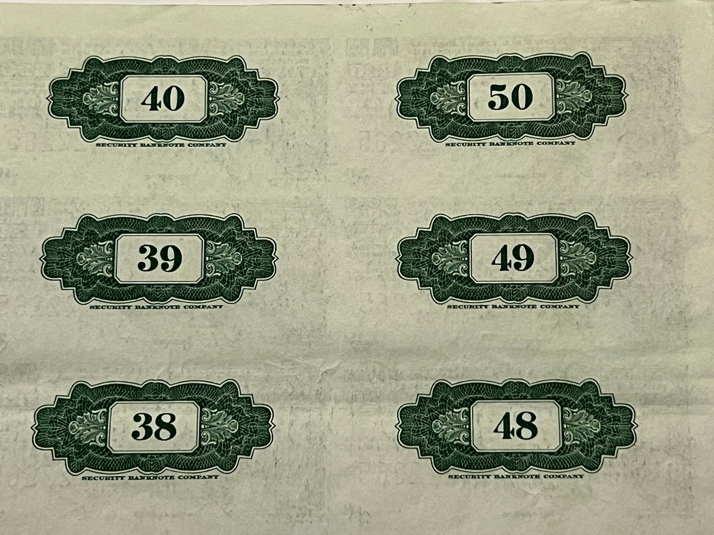 Six vintage security banknote company coupons numbered 38-50 printed in green and black on cream paper