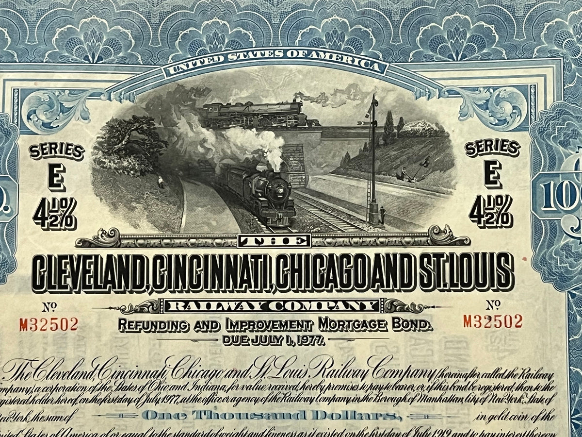 Antique railroad bond certificate with ornate blue border, steam locomotive engraving, "Series E 4½%" text, and "$1000" denom