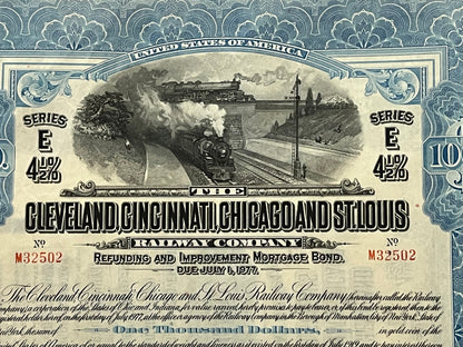 Antique railroad bond certificate with ornate blue border, steam locomotive engraving, "Series E 4½%" text, and "$1000" denom
