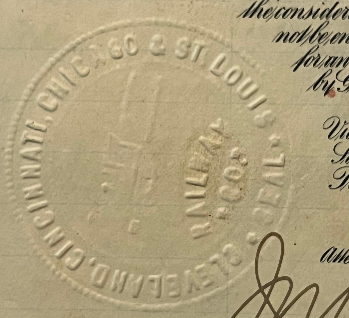 Close-up of embossed circular seal on cream-colored 1927 railroad bond document reading "Big Four St Louis Railway" with hand