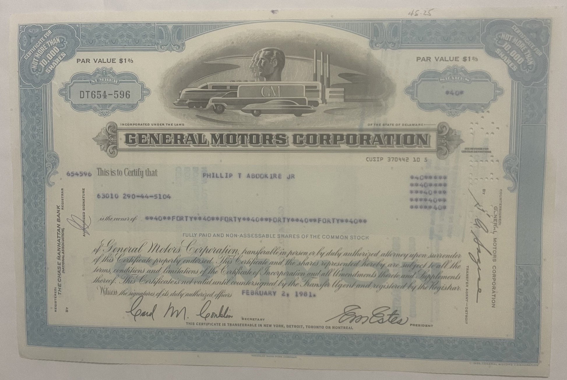 Vintage General Motors Corporation stock certificate from with blue ornamental borders, streamlined train illustration