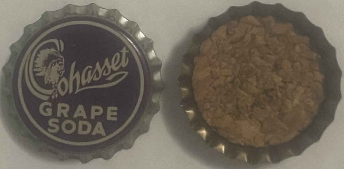 Top and underside of the Cohasset Grape Soda cap side by side: the purple and cream printed top and the cork liner inside