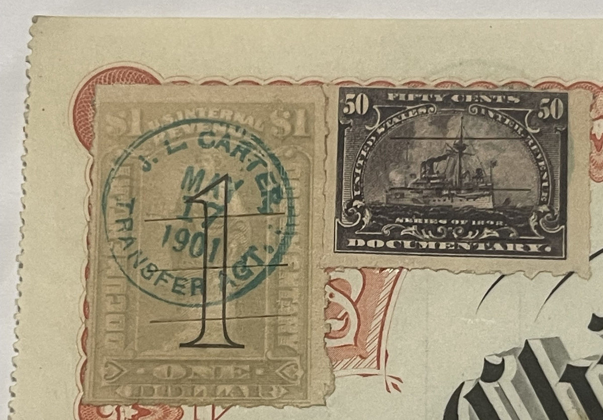 Close-up of vintage railroad stock certificate with green postmark, 50-cent steamship documentary stamp, and ornat