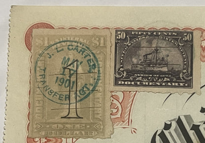 Close-up of vintage railroad stock certificate with green postmark, 50-cent steamship documentary stamp, and ornat