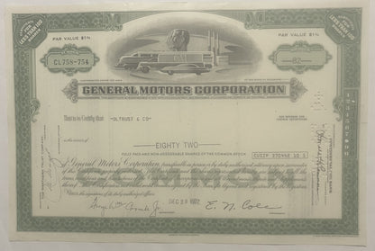Vintage General Motors stock certificate for 82 shares, featuring streamlined GM locomotive vignette