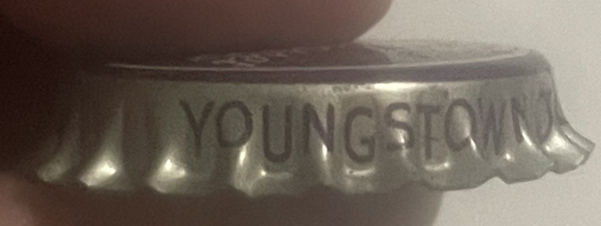 Silver skirt of the Cohasset cap printed YOUNGSTOWN in dark letters