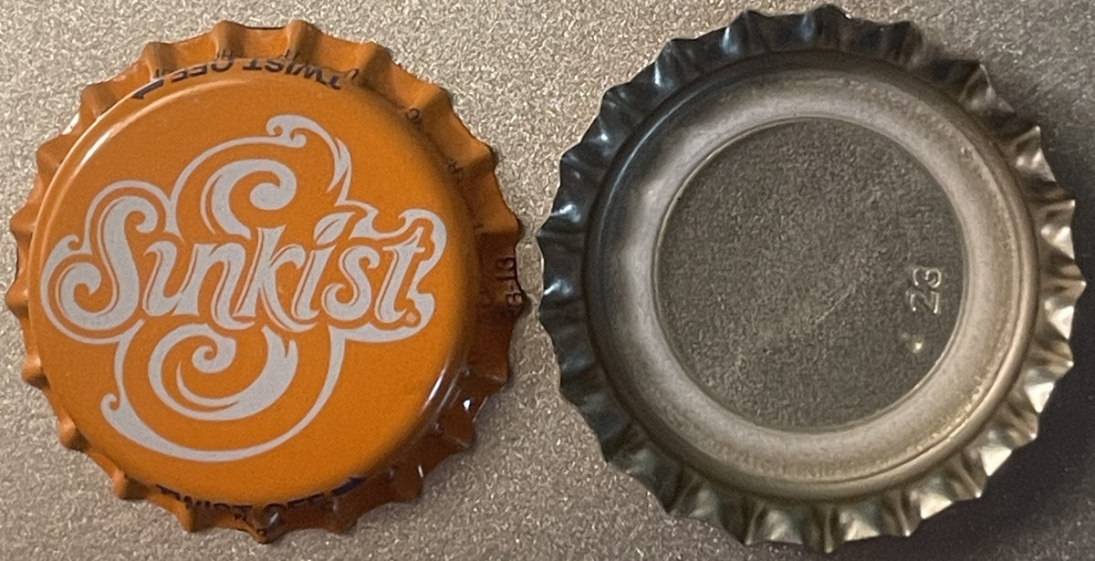 Vintage Sunkist orange soda bottle cap shown front and back, orange side displays white decorative swirl lettering, reverse s