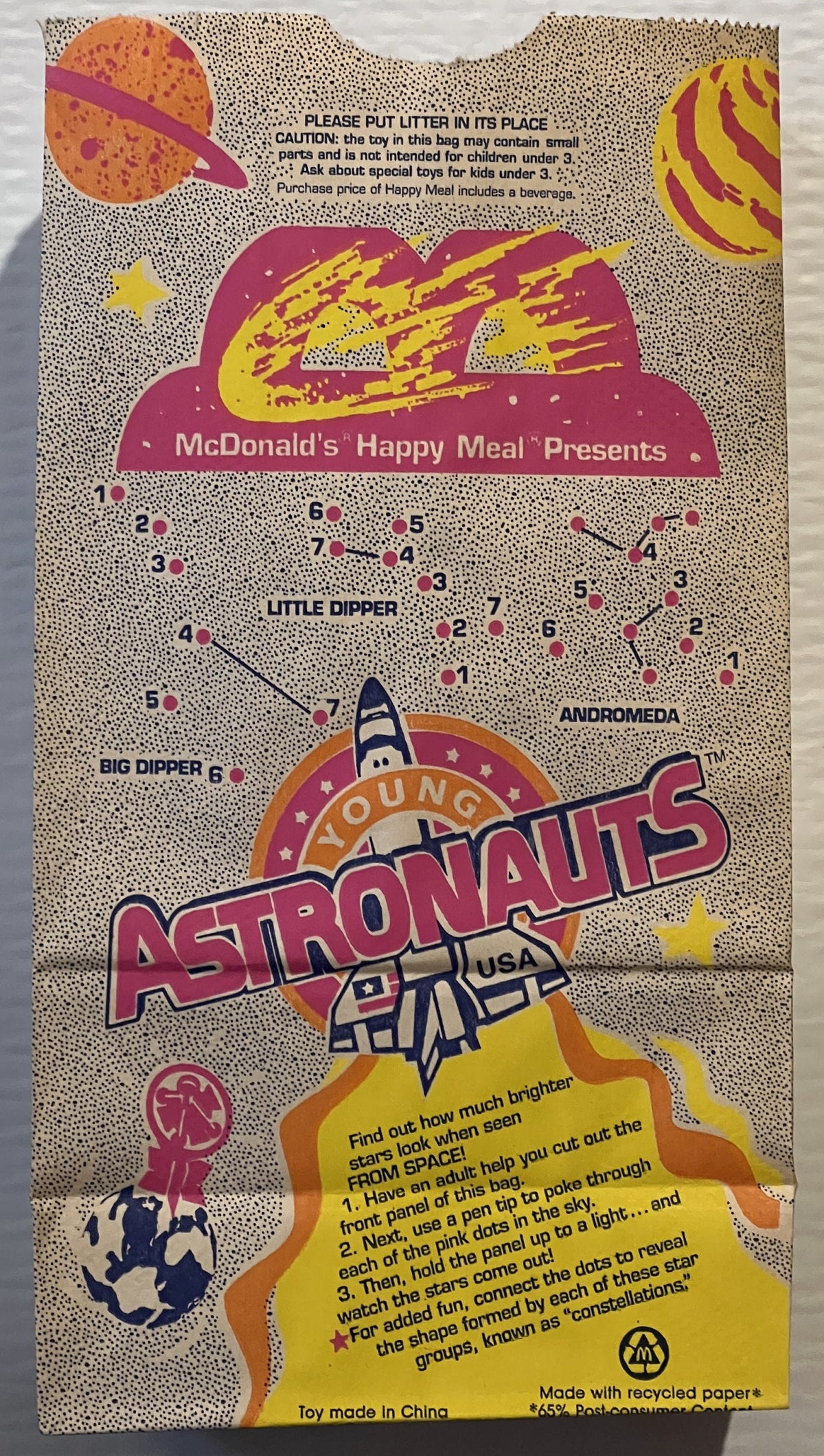 Vintage McDonald's Happy Meal bag featuring Young Astronauts space theme with colorful planets, rocket, and connect-the-dots 