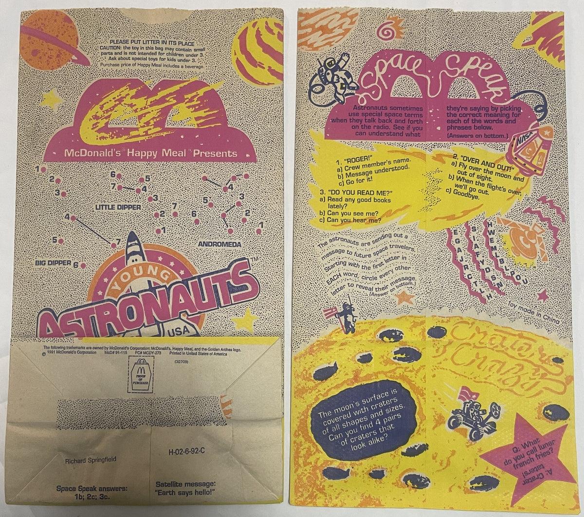 Front and back of vintage 1991 McDonald's Young Astronauts Happy Meal bag with purple, yellow, and tan space-themed graphics 