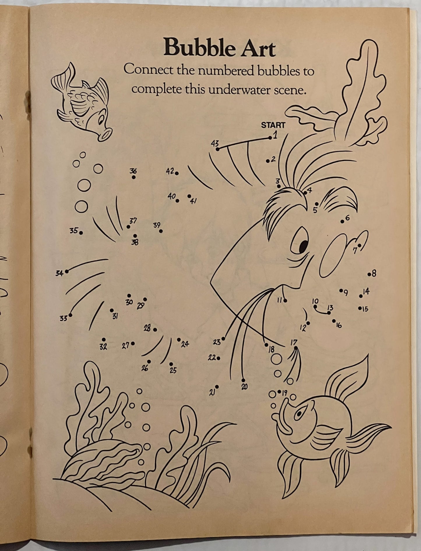 Vintage activity book page showing numbered bubble connect-the-dots underwater scene with fish, seahorse, and seaweed illustr