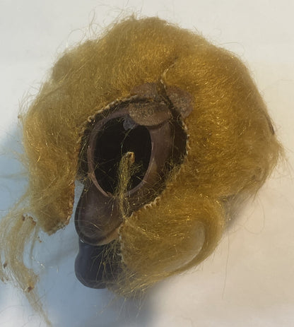 Vintage ALF finger puppet with golden-brown fuzzy body and dark brown rubber face, shown against white background from above