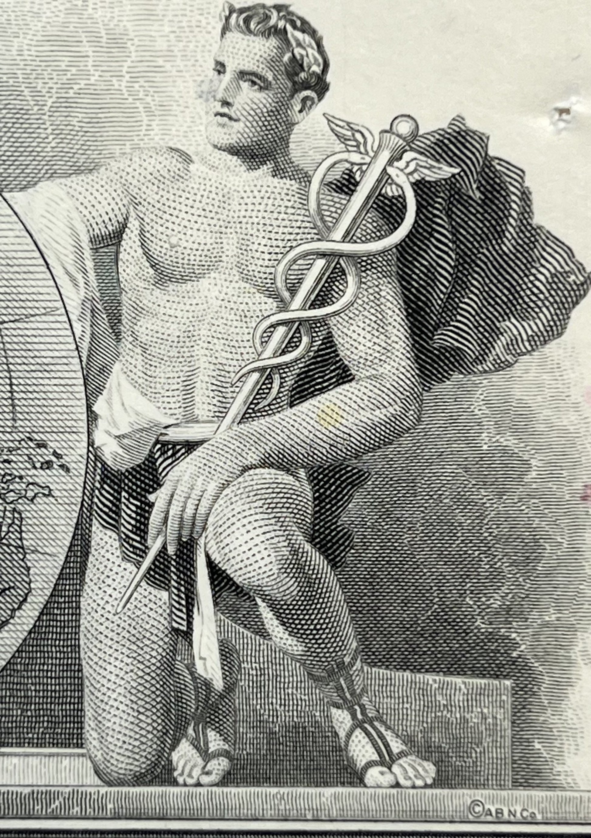 Black and white engraving of a classical male figure holding a caduceus staff, rendered in fine line hatching technique