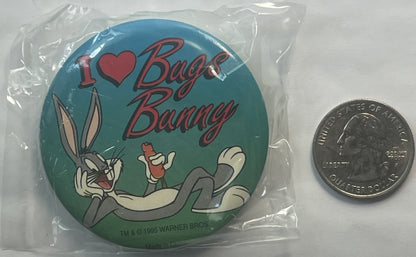 Sealed plastic package containing round pin with teal background, Bugs Bunny cartoon character, red "I ❤ Bugs Bunny" text, an