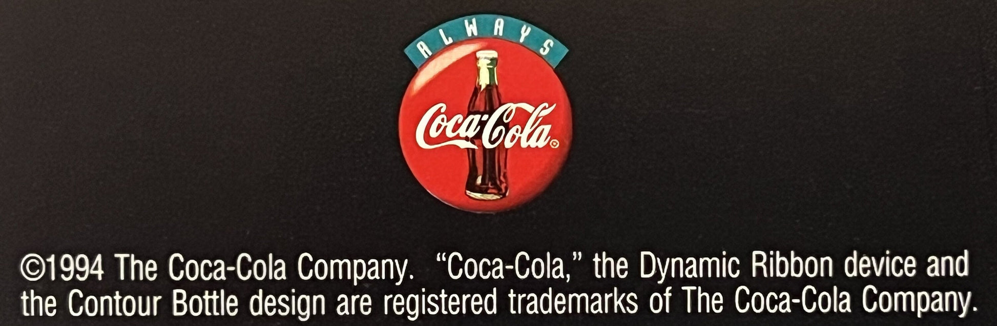 Vintage Coca-Cola door hanger with red circular logo, bottle image, teal "Always" banner, and 1994 copyright text on dark bac