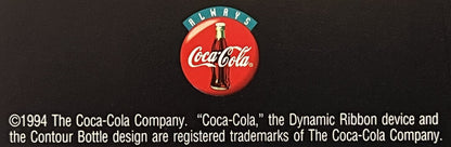 Vintage Coca-Cola door hanger with red circular logo, bottle image, teal "Always" banner, and 1994 copyright text on dark bac
