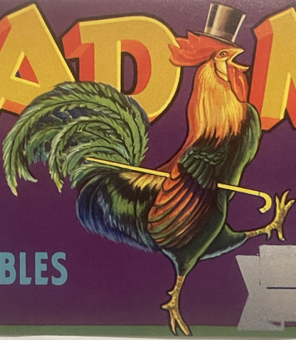 Vintage rooster crate label with colorful illustration of a red and green rooster wearing a top hat against purple background