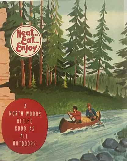 Vintage can label with red circles containing "Heat...Eat...Enjoy" and "A North Woods Recipe Good As All Outdoors" text, feat
