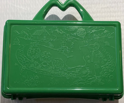 Green plastic lunch box with embossed McDonaldland characters and scenery, shown from front angle against white background