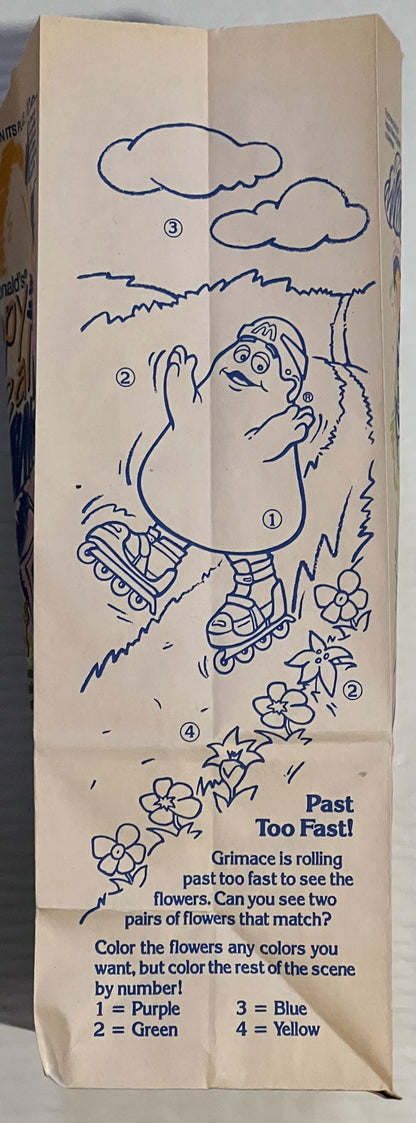 Vintage McDonald's Happy Meal bag with blue line drawing of character on roller skates, numbered coloring activity, text read