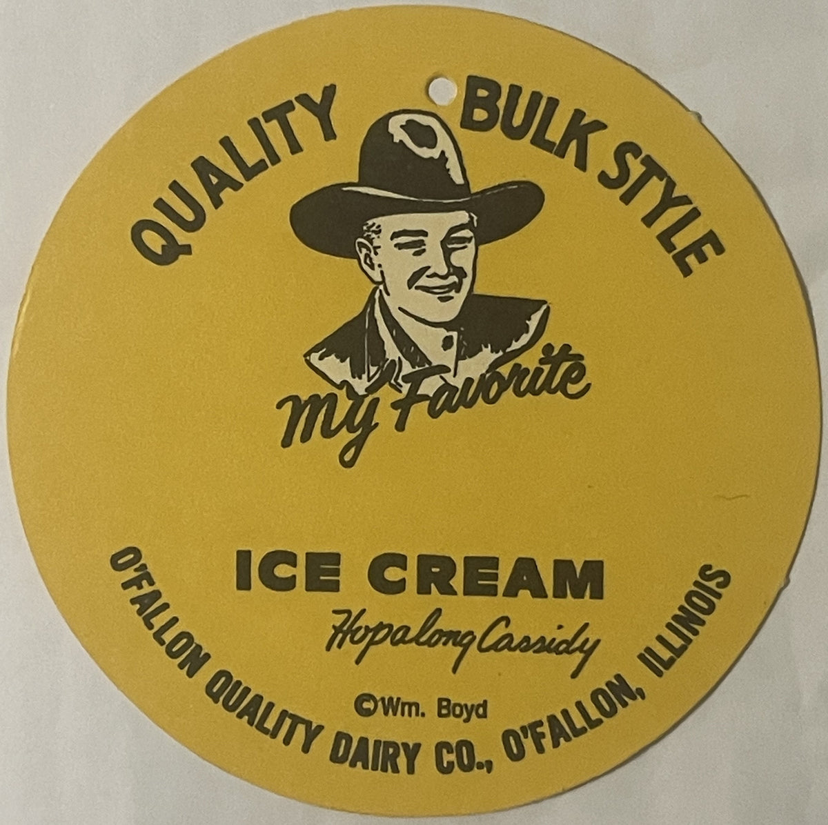 Circular yellow vintage ice cream sign featuring Hopalong Cassidy illustration with cowboy hat, text reading "Quality Bulk St