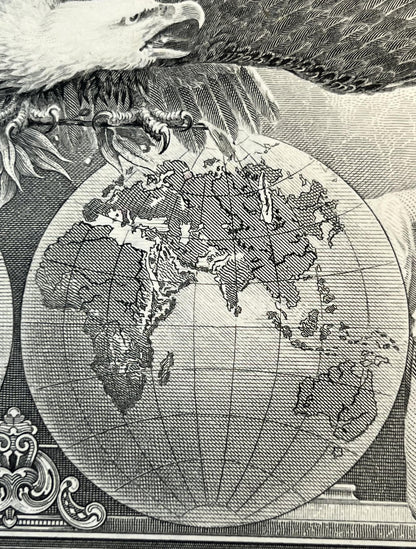 Black and white engraved map showing North America and surrounding continents held by an eagle, with ornamental cartouche det
