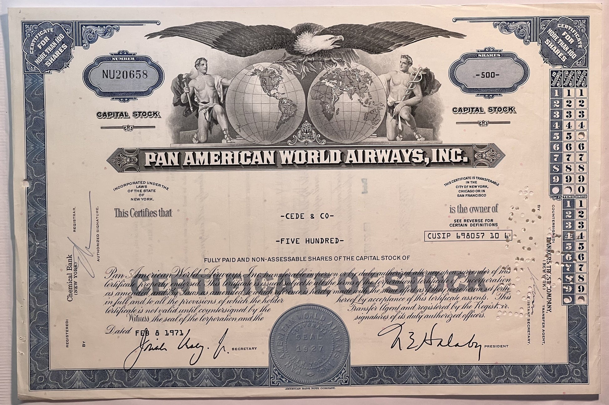 Vintage Pan American World Airways stock certificate with blue borders, eagle emblem, globe imagery, and signatures dated Feb