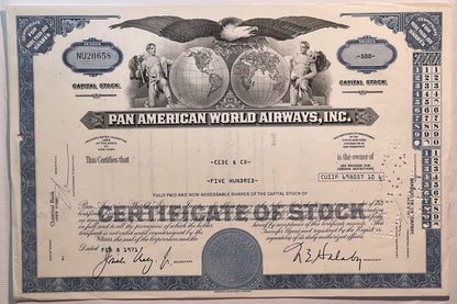 Vintage Pan American World Airways stock certificate with blue borders, eagle emblem, globe imagery, and signatures dated Feb