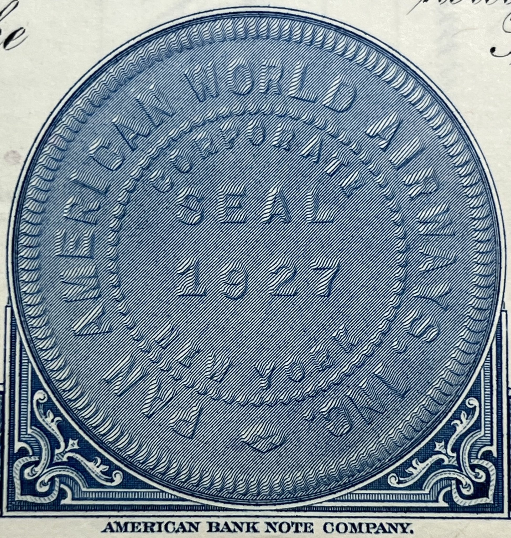 Blue engraved oval vignette from American Bank Note Company stock certificate with ornamental corner scrollwork and diagonal 