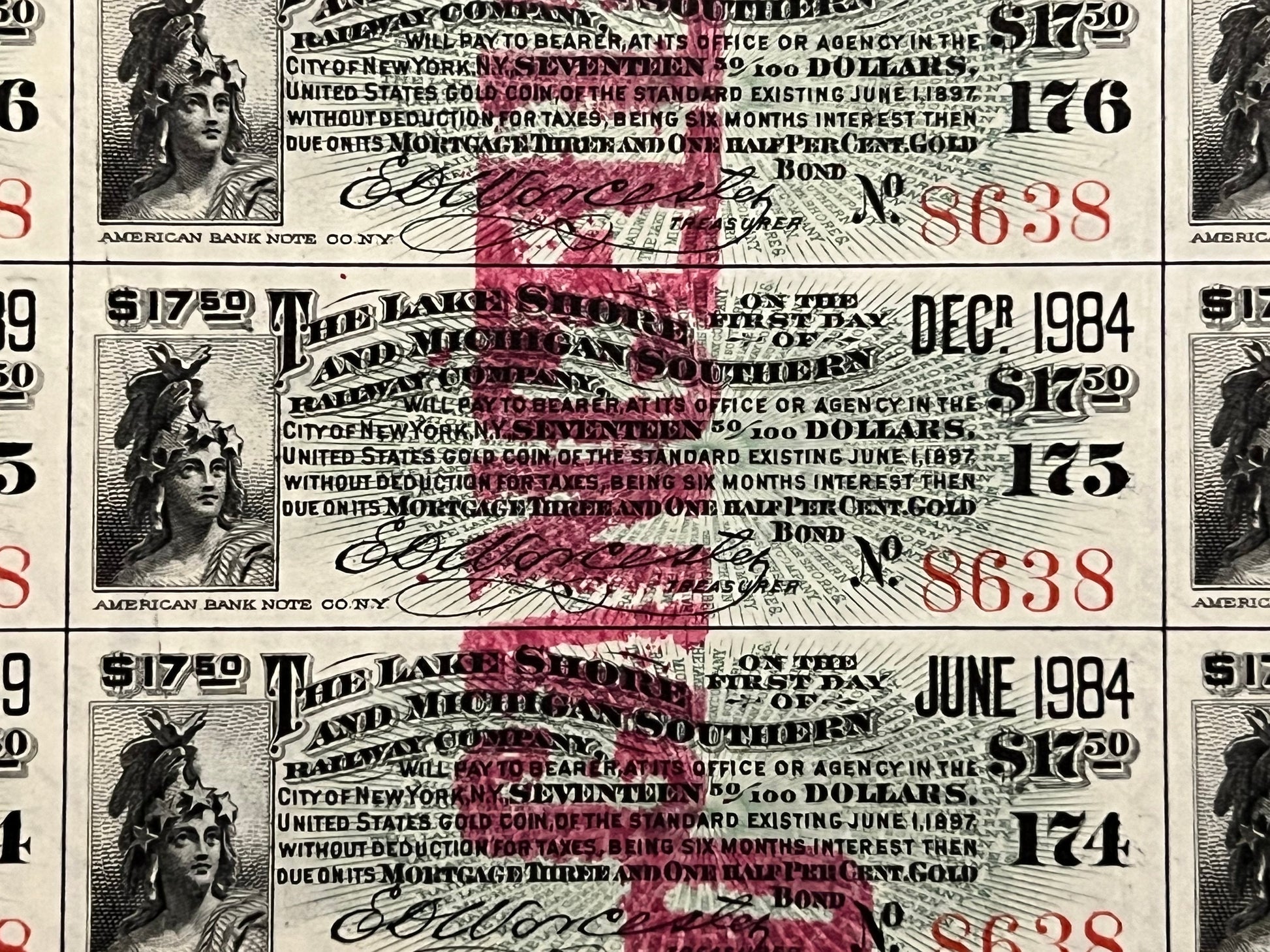 Three overlapping antique railroad bond certificates with engraved female portrait, ornate text, red stamps and handwritten s