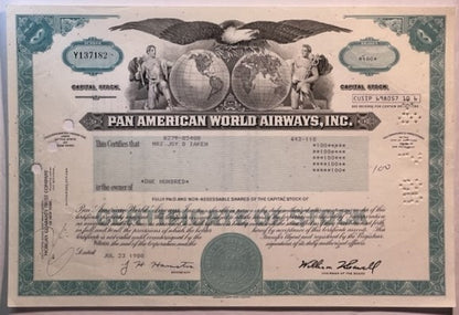 Vintage Pan American World Airways stock certificate with teal borders, eagle emblem, and globe imagery on cream background