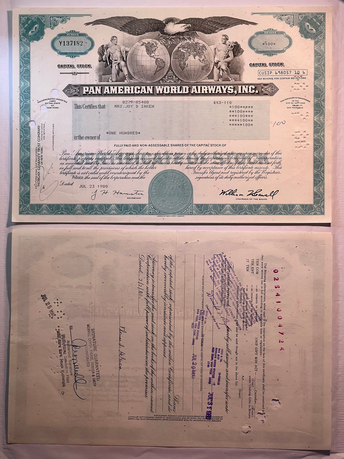 Vintage Pan American World Airways stock certificate, featuring teal borders, eagle emblem, and globe ima