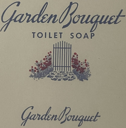 Vintage Garden Bouquet toilet soap label with cursive blue text, decorative garden gate and red flowers illustration on cream