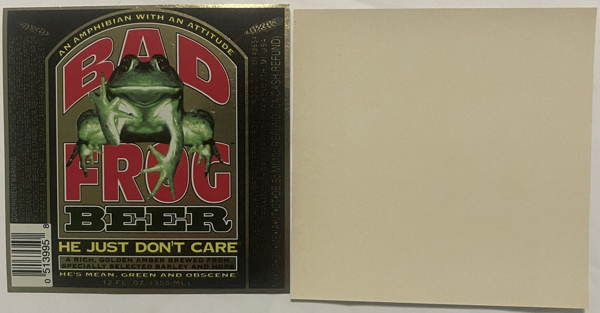 Vintage Bad Frog Beer label featuring green frog illustration with red lettering and tagline "He Just Don't Care" on dark