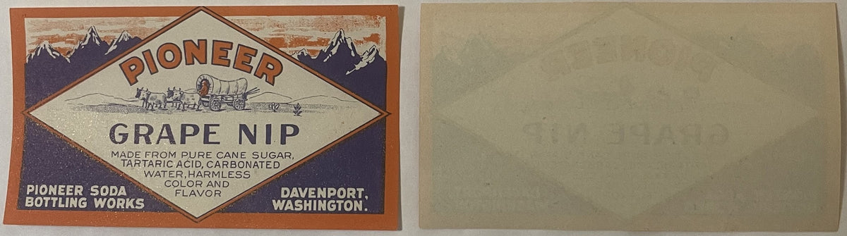 Vintage Pioneer Grape Nip soda label from Davenport, Washington, featuring mountains, covered wagon, and diamond-shaped