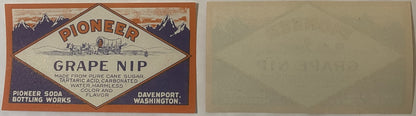 Vintage Pioneer Grape Nip soda label from Davenport, Washington, featuring mountains, covered wagon, and diamond-shaped