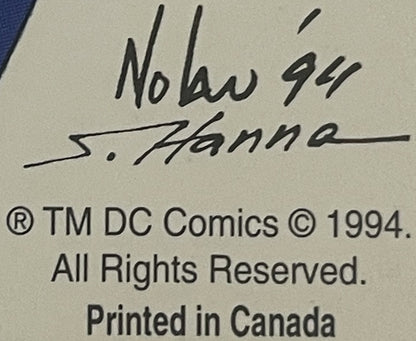 Close-up of postcard back showing handwritten inscription "Nolan 94" and signature "S. Hanna" with DC Comics copyright notice