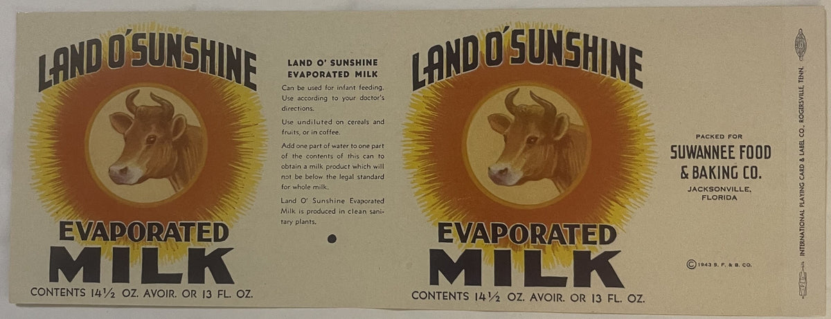 Full Land O' Sunshine label laid flat, two cow-and-sunburst panels flanking the printed directions