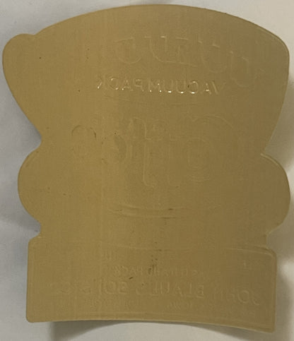 Cream-colored embossed coffee label with wavy edges, text reading "GOLD CUP" and "IOWA VACUUM PACK" visible on tan background