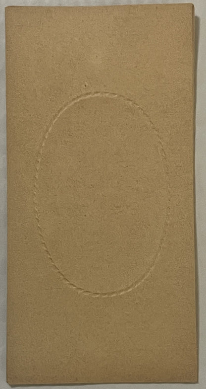 Tan cardboard box insert with embossed oval frame, shown flat against white surface