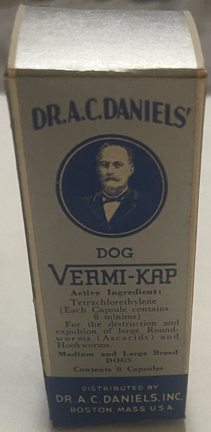 Vintage Dr. A.C. Daniels Dog Vermi-Kap medicine box with portrait medallion, blue and cream packaging, Boston Mass USA