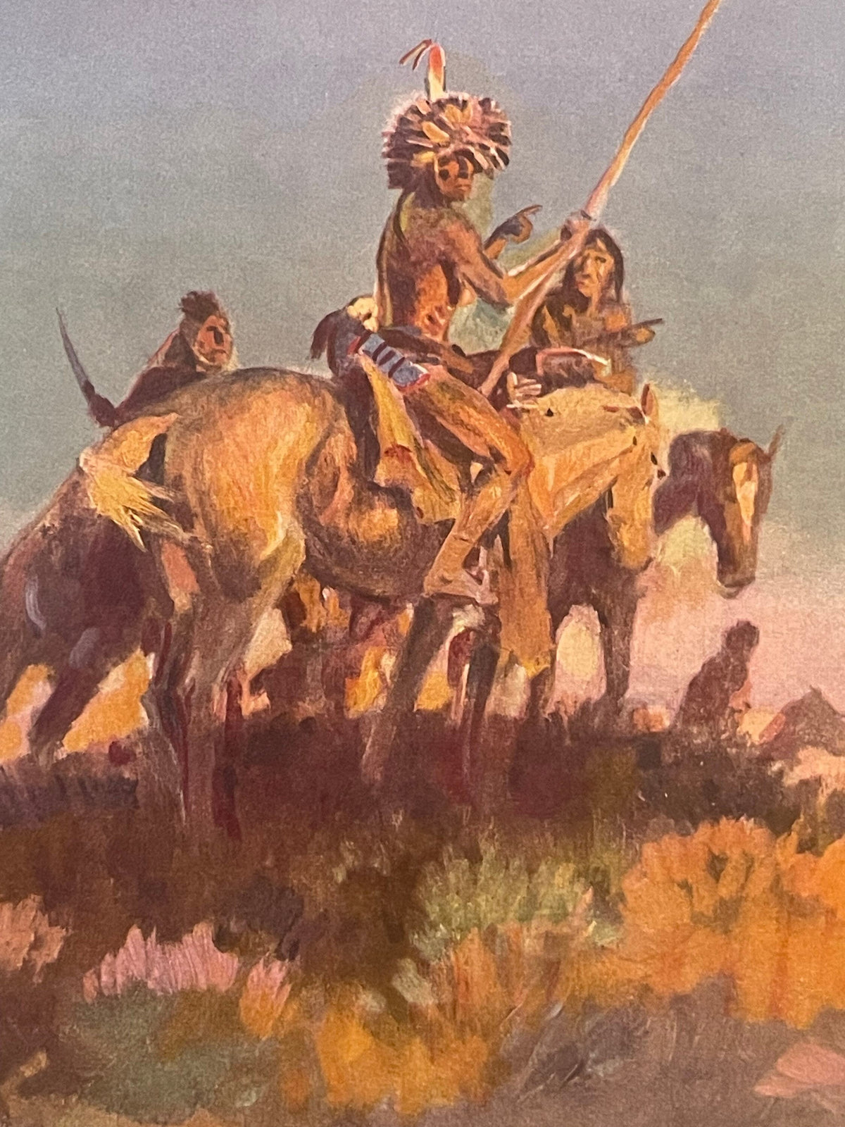 Vintage print of Native American warriors on horseback with spears, rendered in warm earth tones and browns, showing dynamic 
