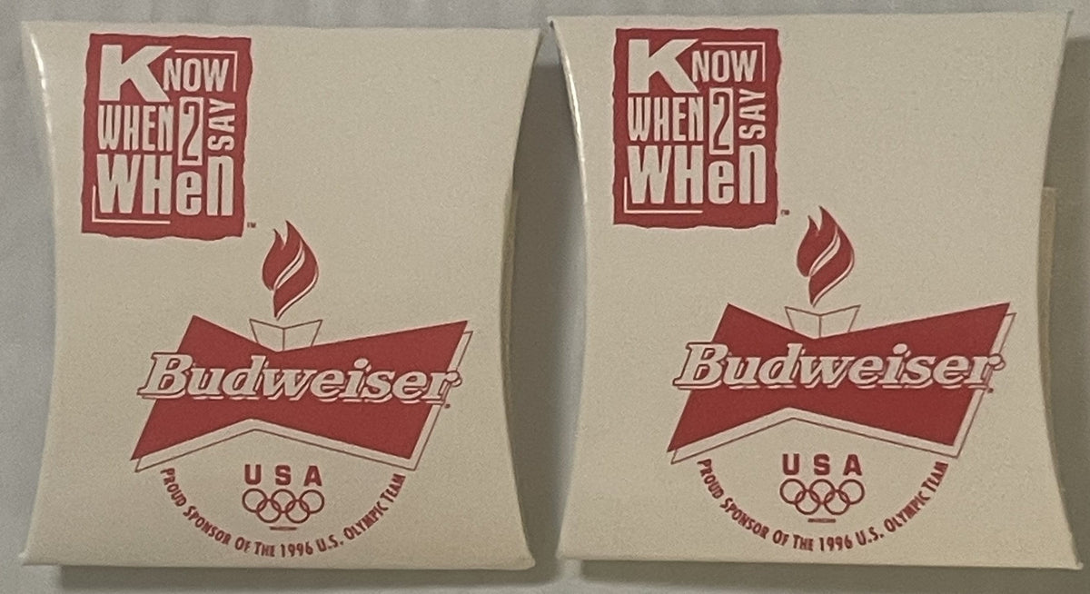 Two unopened Budweiser 1996 Olympics USA sewing kits with red and white packaging, shown front and angled view.
